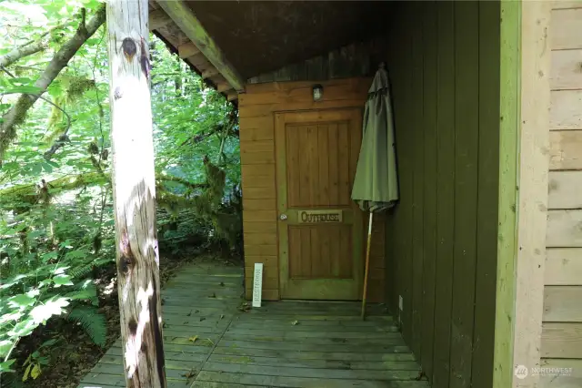 Outdoor bathroom, with a covered exterior area.