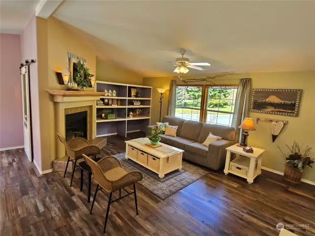 Cozy up to the easy, gas fireplace in the living space just off the kitchen.