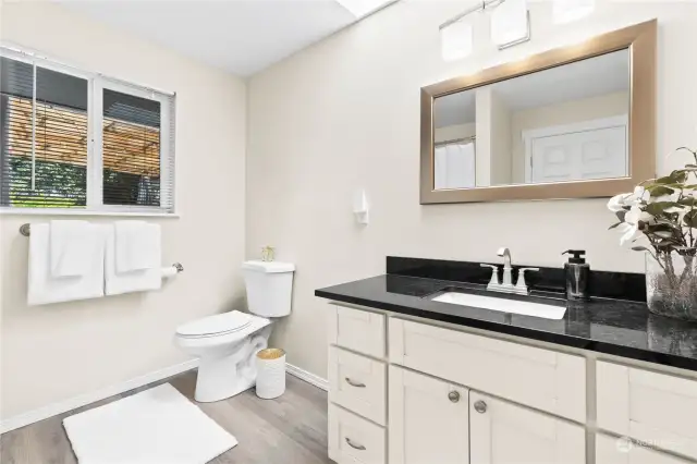 Primary Bath, Includes quartz counter top, tons of storage and full tub and shower enclosure!