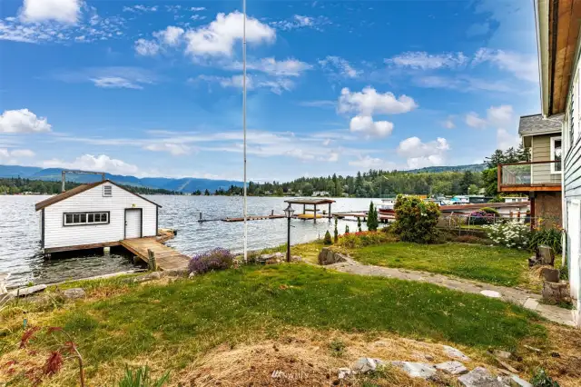 This property is ideal with over 50' of no bank waterfront and a large boathouse with a sling.