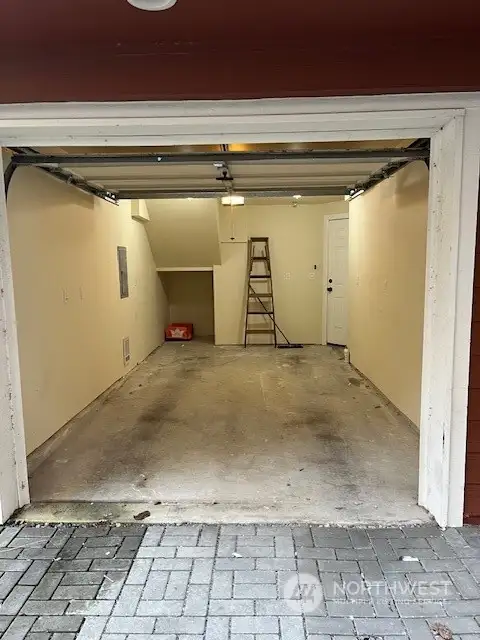 The view of the large garage, storage at the back.