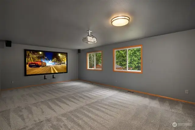 Large Theater-style media room is wired for seven speakers, 7.2 or 9.2, the Epson HD Projector and a Stewart Film Screen will remain.