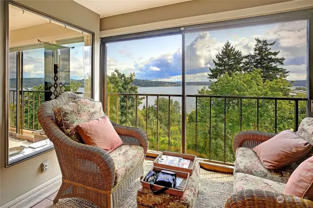 Sunroom view of Lake Washington and Cascade mountains to the northeast. Slider window wall