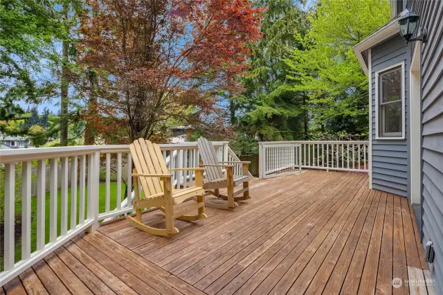 A large rear deck flows to the large back yard