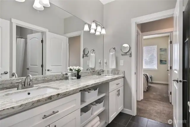 Remodeled main jack/jill bathroom with storage, dual vanity and separate bathroom area for privacy.