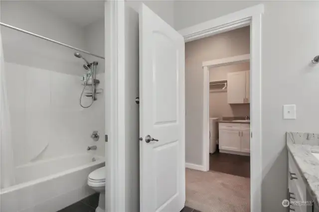Main bathroom has a door for privacy from the jack/jill vanity area.