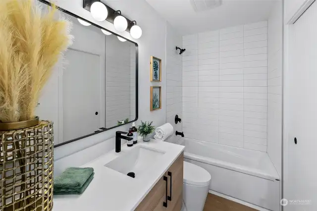 Lower/Entry level full bathroom with storage
