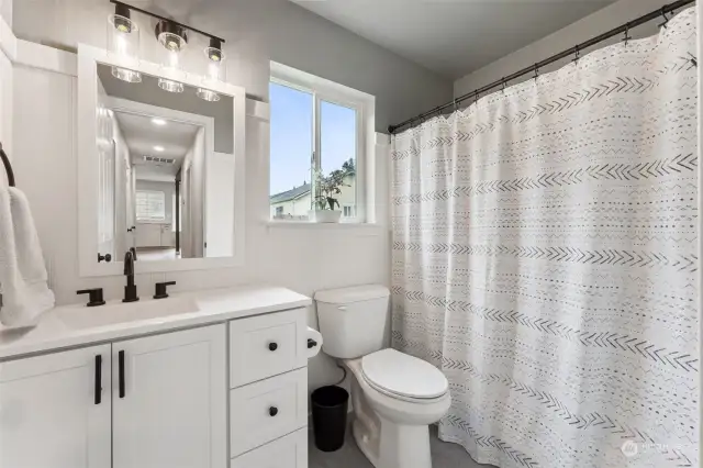 Guest bath is perfectly located down the hall for easy access for guests and family.