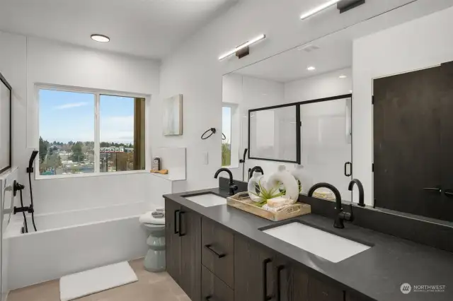 Dual vanity sinks plus water closet and oversized shower means everyone gets their own space!