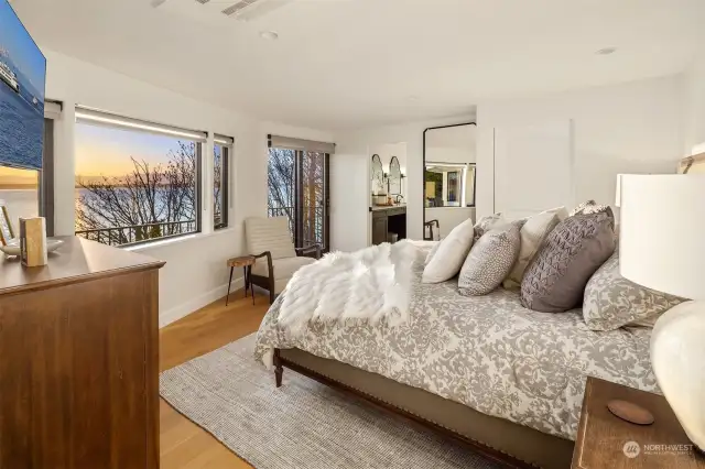 Luxurious primary suite with a wall of windows & private deck to relax and take in the views. Everything you need-walk-in closet, 5-piece en suite bath with steam shower, copper soaking tub & radiant floor heating.