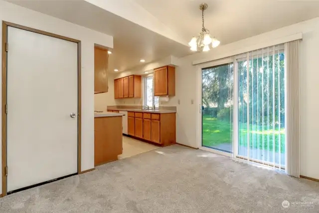 Entrance to the garage is off the dining room where the washer & dryer hookups are located. (unit 35617)