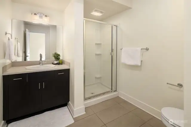bathroom with shower in lower level