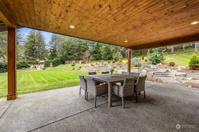 Large, covered patio off kitchen and great room perfect for entertaining in the Northwest.