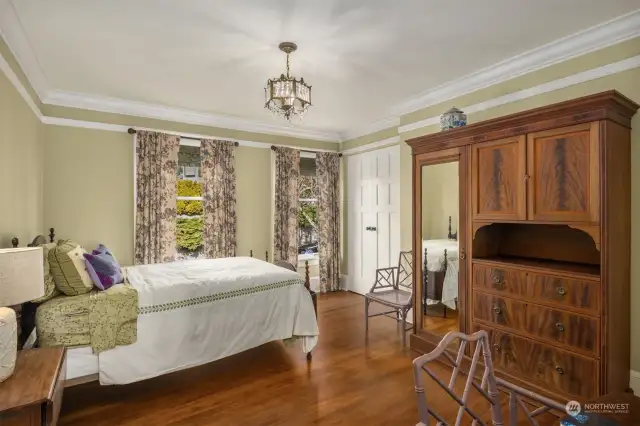 Enchanting north bedroom with two closets and gleaming fir floors.