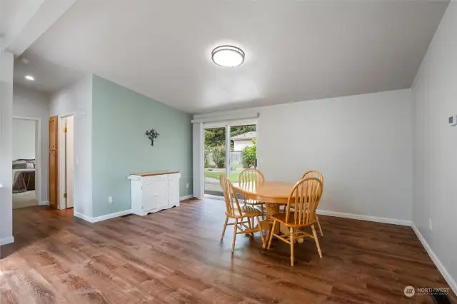 The kitchen nook is large enough to be the dining room.  An ample table and plenty of chairs can be utilized here.  The sliding glass door leads to a private, fenced back yard with patio/awning.