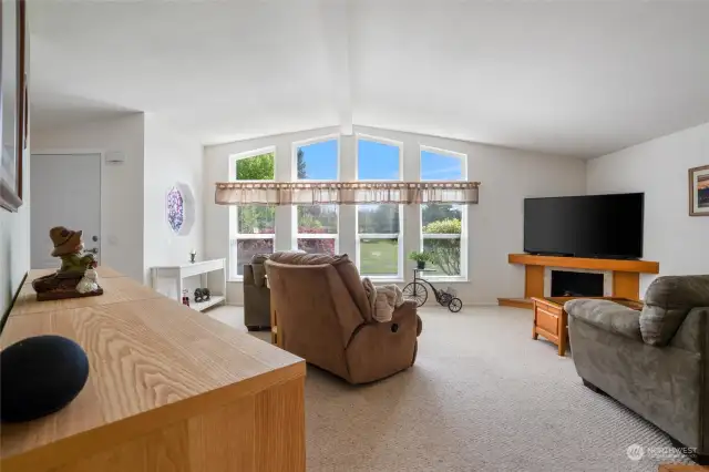 The main living room has territorial views overlooking lush open space.