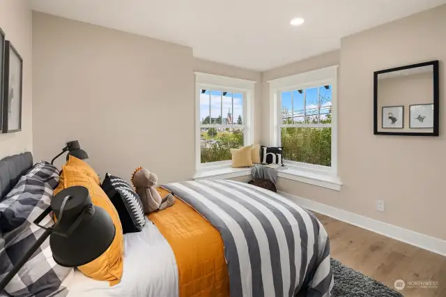 Guest bedroom #1 with city and mountain views.