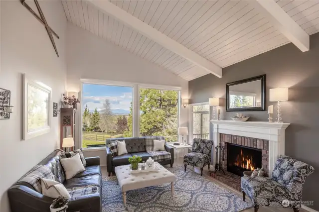 Warm and inviting main floor living room with captivating mountain views.