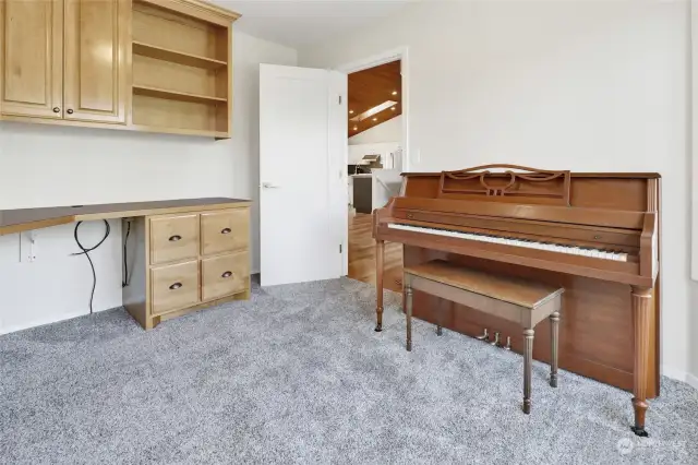 The den/study/office is right off the front door. Piano is included!