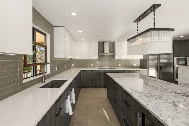 High end stainless steel appliances throughout kitchen