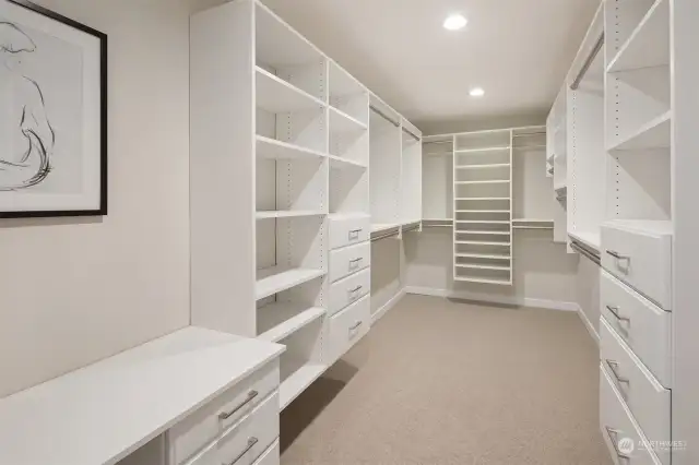 Main floor primary walk-in closet and vanity desk.
