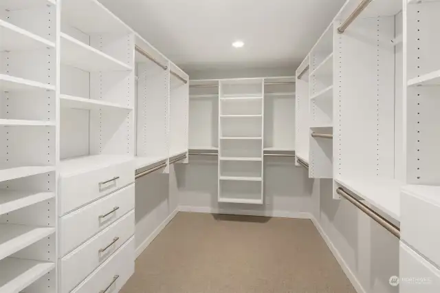 Lower level primary walk in closet, soft close drawers and adjustable shelving.