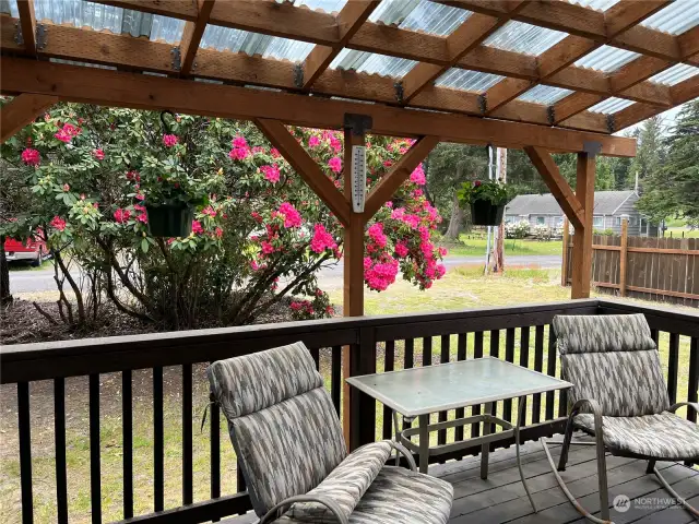 Covered front deck with plenty of room for guests.
