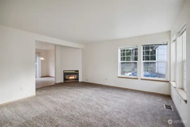 As you enter the home, you are greeted by a large living space and fireplace.