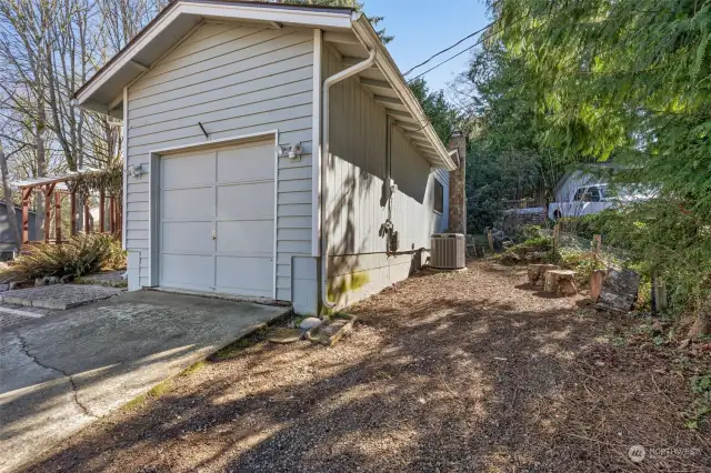 Garage with room for RV parking on side of driveway
