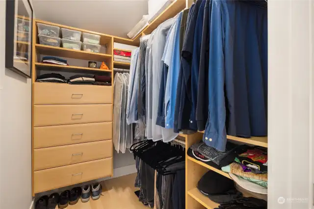 Both primary walk-in closets organized with built-ins.