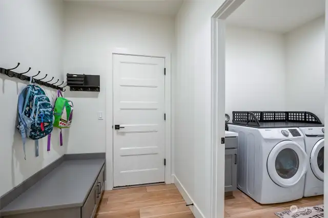 Laundry area with a convenient cabinet.