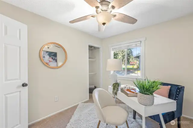 Third bedroom has newer remote-controlled ceiling fan, fresh carpet and paint, and view to the front of the home.