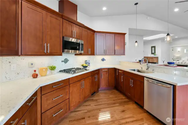 This well designed kitchen is a real treat to cook in. Note the 5 burner gas stovetop, extra deep stainless sink & whole house vacuum system toe-kick for easy clean up.