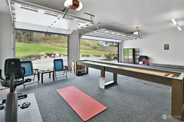 Homeowner uses 3rd bay for a workout and gaming area.