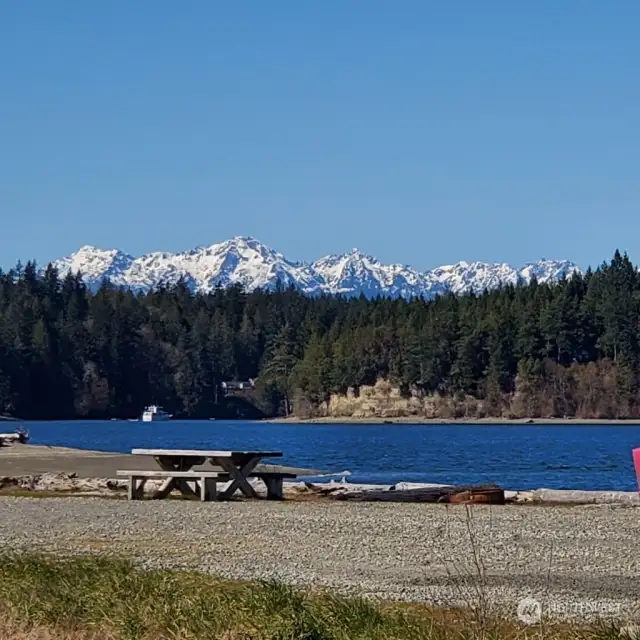 Picnic table/firepit at spit with Olympic Mts.  From here you can also see Mt Rainier.