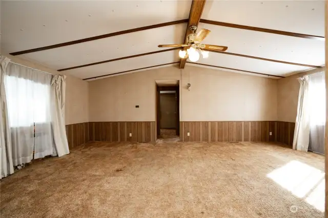 Large open living room with vaulted ceilings.