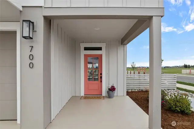 Large, covered front porch with zero step entry