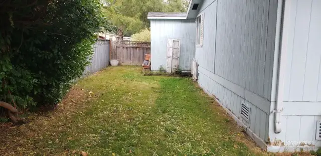 An Opposite View of the Huge Pet Friendly Fenced Backyard.