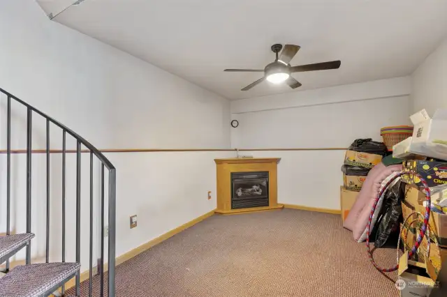 Spiral Stairs off the kitchen lead to this bonus room.