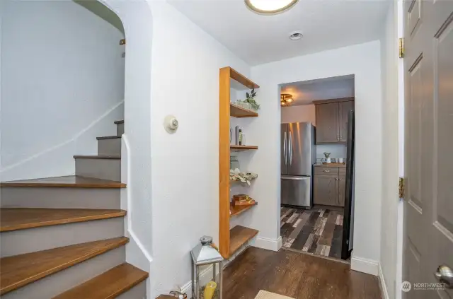 Stairs lead you through graceful curved hallway to 2 bed/3/4 bath
