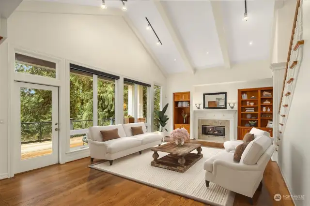 Virtually staged Great Room.  With high vaulted ceilings, a gas fireplace and built in storage.