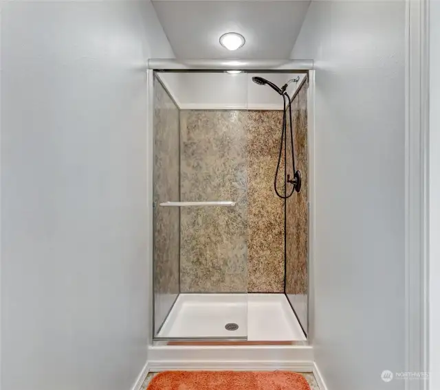 Primary suite features a stand up shower in addition to the soaking tub.