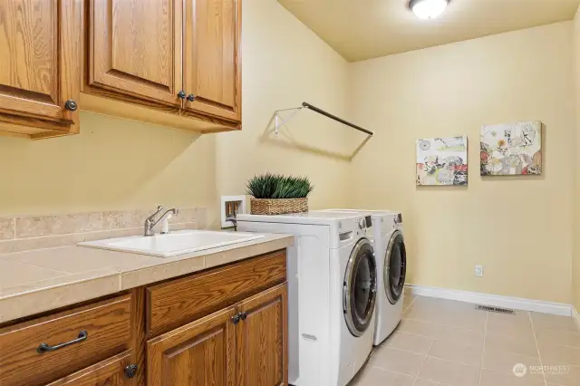 Large laundry room off the kitchen, leave your washer & dryer behind when you see these upscale units. You also get a drop down ironing board for easy access.