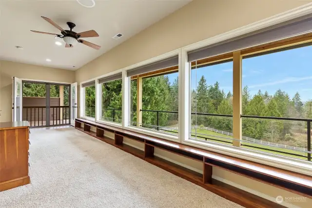 Need an exercise room off Master suite? How about a den? The wall of windows offers distant views of the mountain tops. Plus a covered viewing deck!!