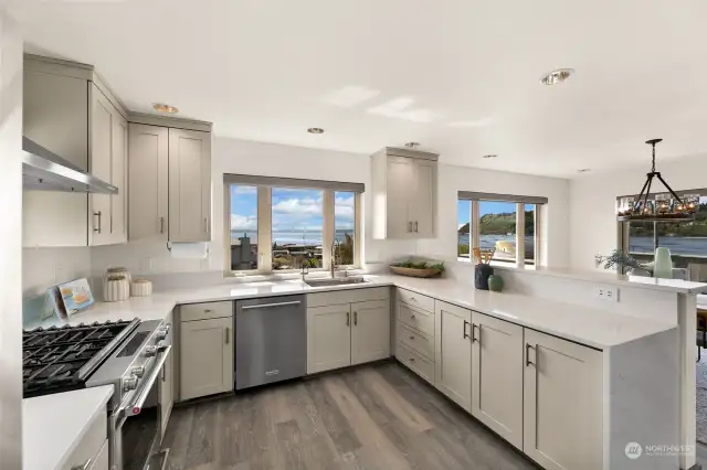 This kitchen is a true delight - gas cooking, stainless steel, coordinating Kitchen Aid appliances and abundant, elegant soft-close cabinetry. Not to mention the open bar area to the dining room.