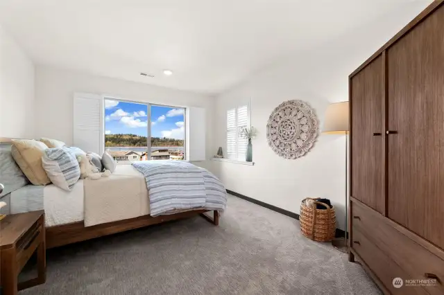 The first of two lower level rooms, which our sellers use as bedrooms, both with fabulous western views.