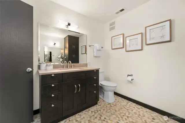 This lower level bathroom is so spacious with loads of storage!
