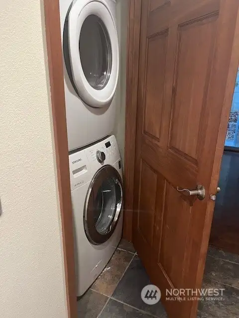 The washer and dryer are located on the lower floor.