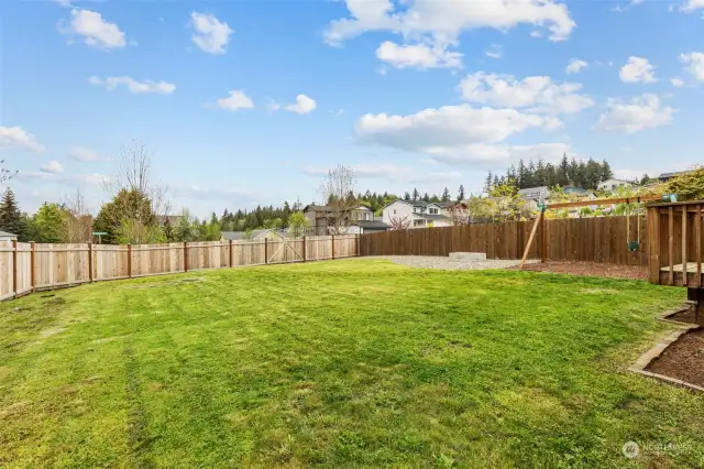 Play ball, run in circles, or garden. Light, bright, generous back yard with new cedar fence.