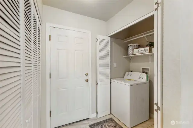 Laundry off kitchen, door to garage and doors to the left - pantry for even more storage!
